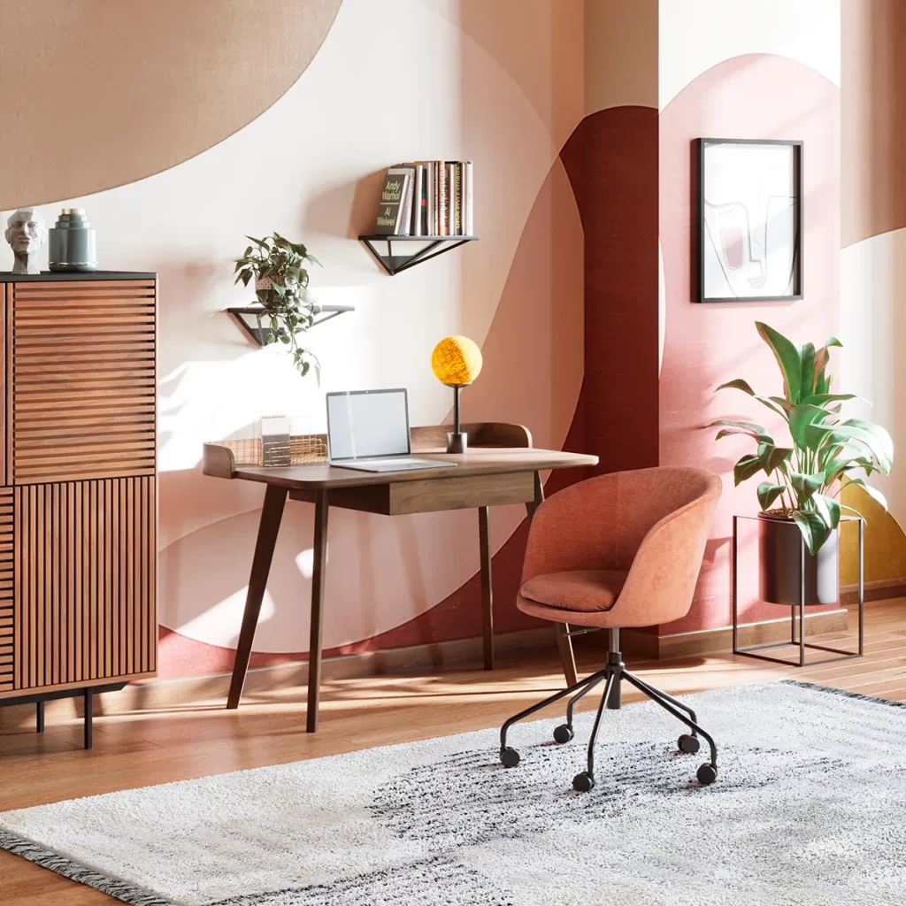 Bureau Dixon en bois avec un tiroir de la marque Kare Design exposé dans un coin bureau au ton rose avec une chaise pivotante, des rangements et de la décoration